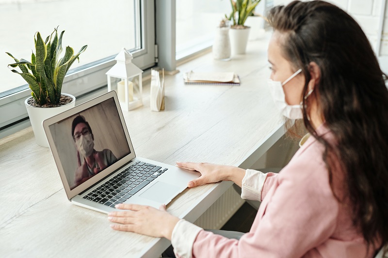 photo of a women talking to a doctor online