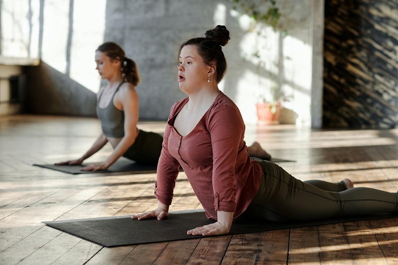 stock photo of two women in a yoga class