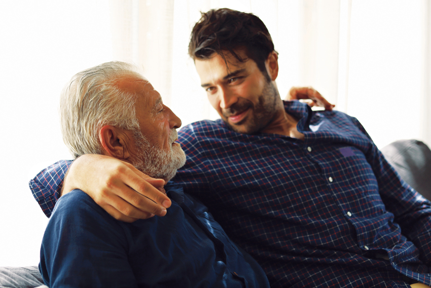 photo of an adult talking with an older parent