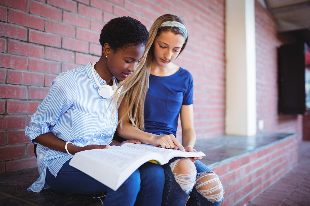 photo of two young women studying together