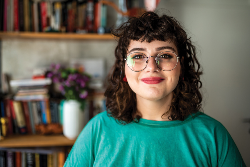 Stock photo of young woman looking directly at camera