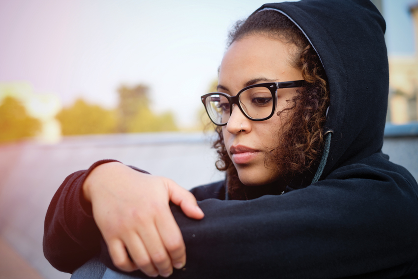 Stock photo of pensive young woman