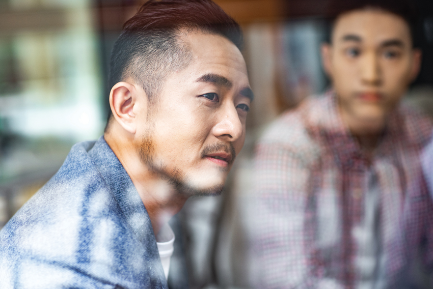 Stock photo of a man looking out the window