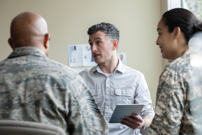 Stock photo of doctor and military personnel
