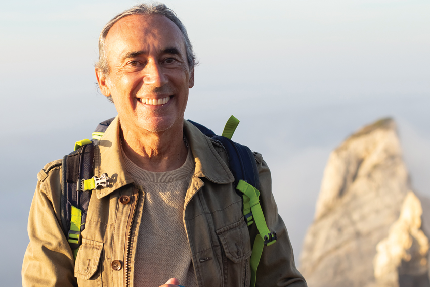 Stock photo of older man on a hike