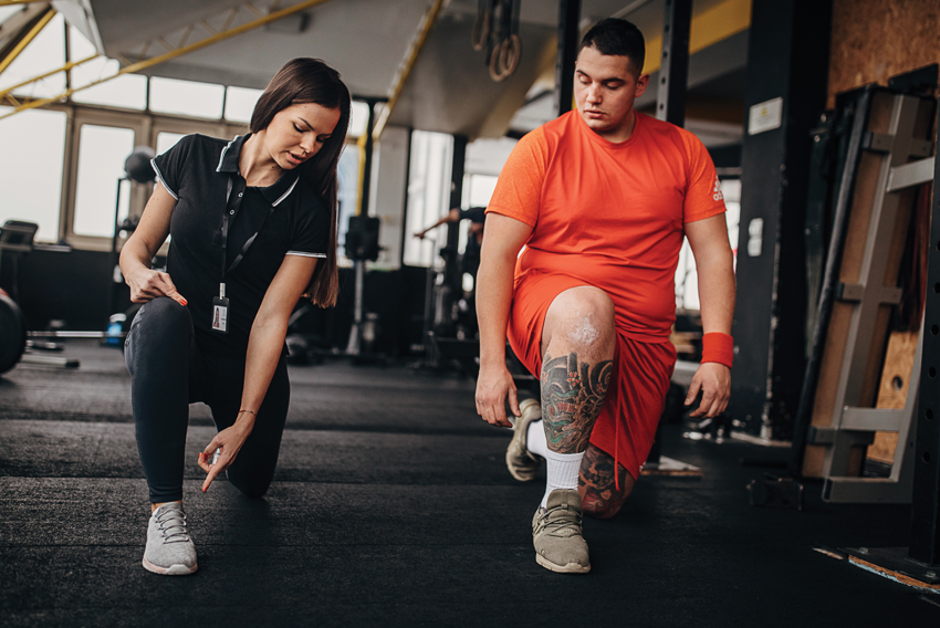 Stock photo of a personal trainer and a client