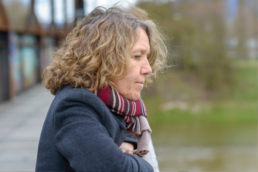 Stock photo of thoughtful woman looking off into distance