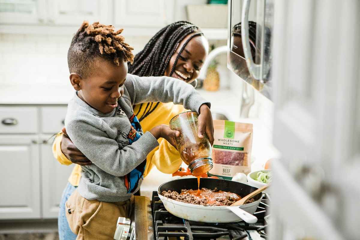 photo of a mom and child cooking together