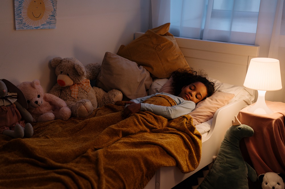 stock photo of a child sleeping in their bed